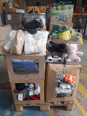 a pile of boxes with stuffed animals on top of them