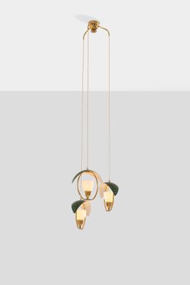 a gold chandelier with three lights hanging from the ceiling
