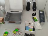 a laptop computer sitting on top of a desk next to other items
