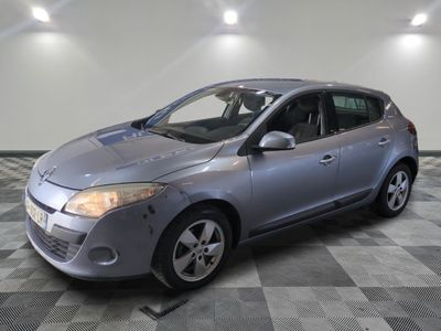 a picture of a silver car parked in a garage