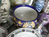 many different types of dishes and cups on the table