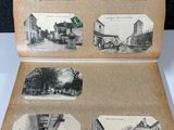 an old photo of a book with pictures of buildings and people