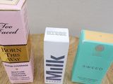 three boxes of milk sitting on a table next to each other