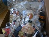 a cardboard box with a doll in it on a table