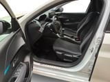 the interior of a car with the door open and the driver ' s seat up