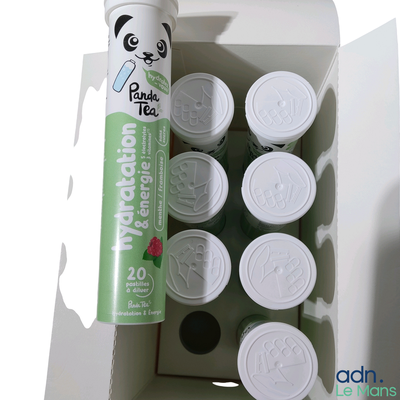 a box with a can of tea next to a can of lip balzer