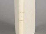 a book that is open on a gray surface