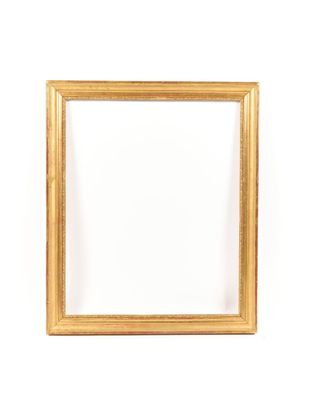 a gold frame on a white wall with a white background