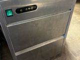a stainless steel dishwasher sitting on the floor