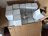 a pile of boxes and a candle on top of a cardboard box