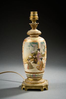 a lamp that has a picture of a woman on it