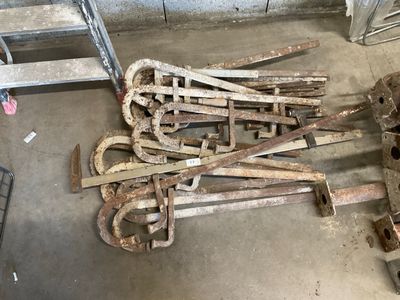 a pile of rusted metal items in a garage