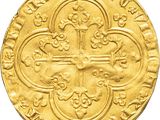 an image of a gold coin with a cross on it