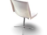 a white chair with a metal base and a white seat