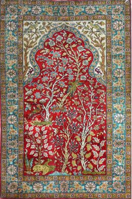a red rug with a floral design on it