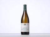 a bottle of wine that is sitting on a table