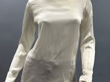 an image of a mannequin wearing a white shirt and pants