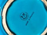 an image of a close up of a blue vase on a table
