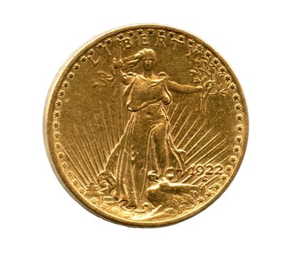 gros plan d'une pièce d'or sur fond blanc