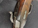 a close up of a gun that is on a table