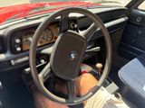 dashboard of a car with a steering wheel and dashboard controls