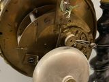 a close up of a clock on a table