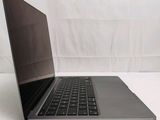 a laptop that is sitting on a white surface