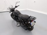 a picture of a motorcycle parked in a white room