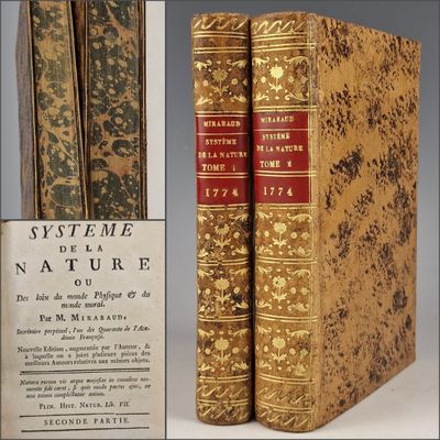 an old book sitting on top of a table next to a book