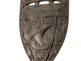 a wooden shield with a dragon on it on a white background