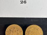 two gold coins, one of which is a sovereign and the other of which is a sovereign