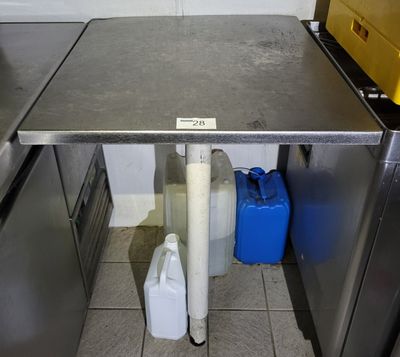 a table that has two containers of water under it