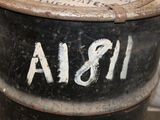 a black barrel with a white writing on it