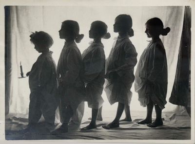 black and white photograph of a group of children standing next to each other