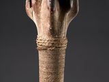 a close up of a vase with a rope wrapped around it