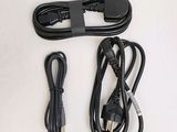 a cord and a charger sitting on a table