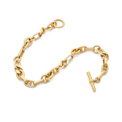 a gold chain bracelet with a cross charm