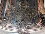 a silver vase that has a coat of arms on it