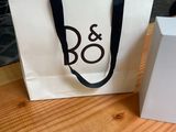 a white bag and a white box sitting on a table