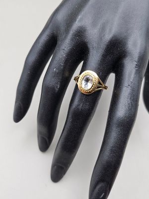 an image of a close up of a person ' s hand with a ring on it