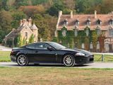 a black sports car parked on the side of the road