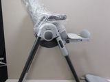 a baby highchair that is wrapped in plastic