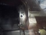 a machine that is working on a piece of metal