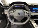 the interior of a car with a steering wheel and dashboard controls