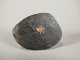 a rock with a heart on it sitting on a table