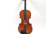 an old violin sitting on a white surface with a white background