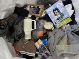 a bag full of items that include shoes, a blender, and other items