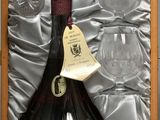 a bottle of wine and two wine glasses in a box