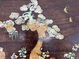 a picture of a wooden table with a painting on it
