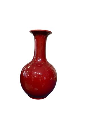 an image of a red vase on a white background
